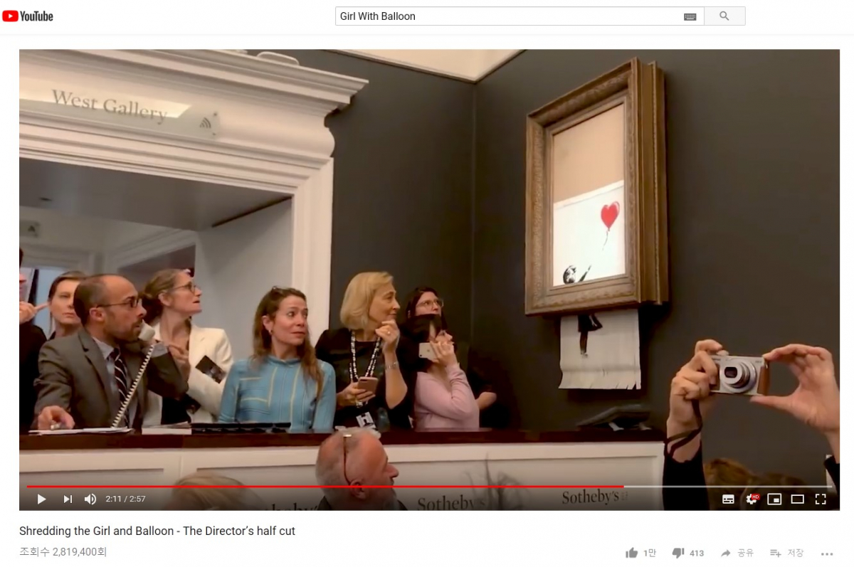 ▲뱅크시는 18일 유튜브에 'Shredding the Girl and Balloon - The Director’s half cut'이라는 제목의 영상을 게재했다. 이 영상에서는 준비 작업과 낙찰과 동시에 파쇄된 경매장의 장면, 사전 리허설 등의 내용이 담겨있다. (출처=유튜브)