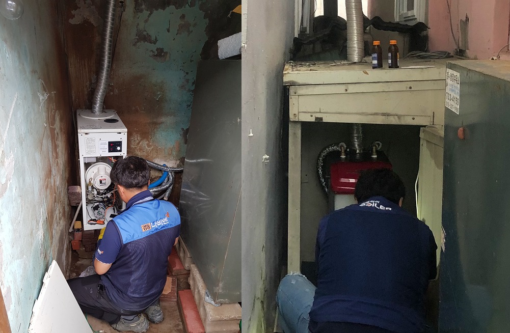 ▲태풍 '미탁'으로 인해 피해를 입은 경북 영덕군에서 경동나비엔(왼쪽)과 귀뚜라미 관계자들이 보일러 복구 작업을 하고 있다. (사진제공=경동나비엔, 귀뚜라미)