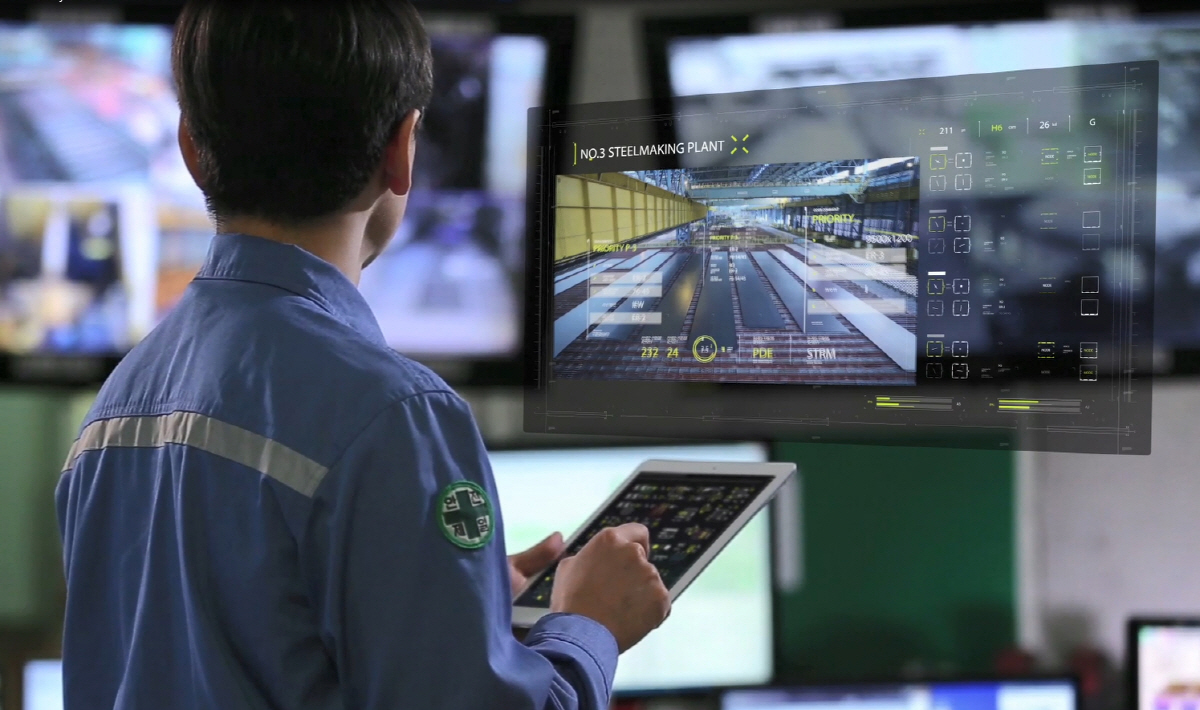 ▲포스코의 스마트팩토리 기술이 적용된 스마트공장의 미래 이미지. 직원이 냉각대에 배열된 제품의 조업 실적과 치수 정보를 스마트 기기를 통해 확인하고 있다. 사진제공 포스코