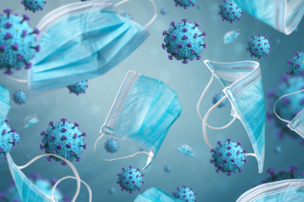 ▲Blue protective surgical face masks surrounded by COVID-19 virus on blue background. Covid-19 concept.