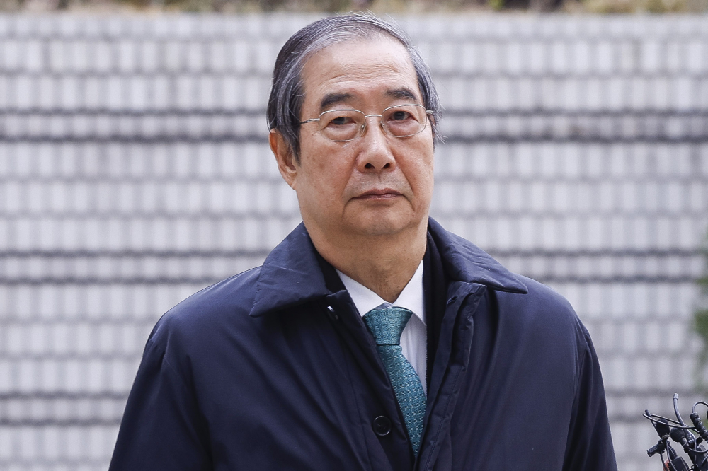 ▲ 한덕수 전 국무총리가 26일 서울 서초구 서울중앙지방법원에서 열린 내란 우두머리 방조, 내란 중요임무 종사 등 혐의 사건 1심 결심 공판에 출석하고 있다. 조현호 기자 hyunho@ (이투데이 DB)