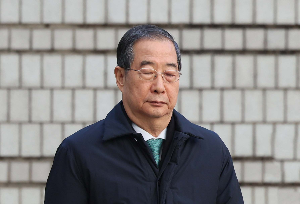 ▲한덕수 전 국무총리가 21일 서울 서초구 서울중앙지방법원에서 열린 내란 우두머리 방조, 내란 중요임무 종사 혐의 사건 1심 선고공판에 출석하고 있다. 신태현 기자 holjjak@